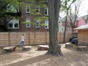 Child leaping among tree steps
