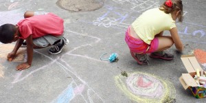 Two Outbackers use giant chalk