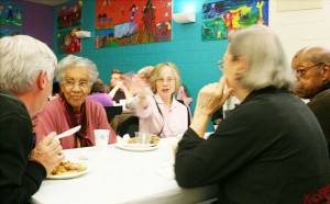 Friends enjoy the Thanksgiving Potluck